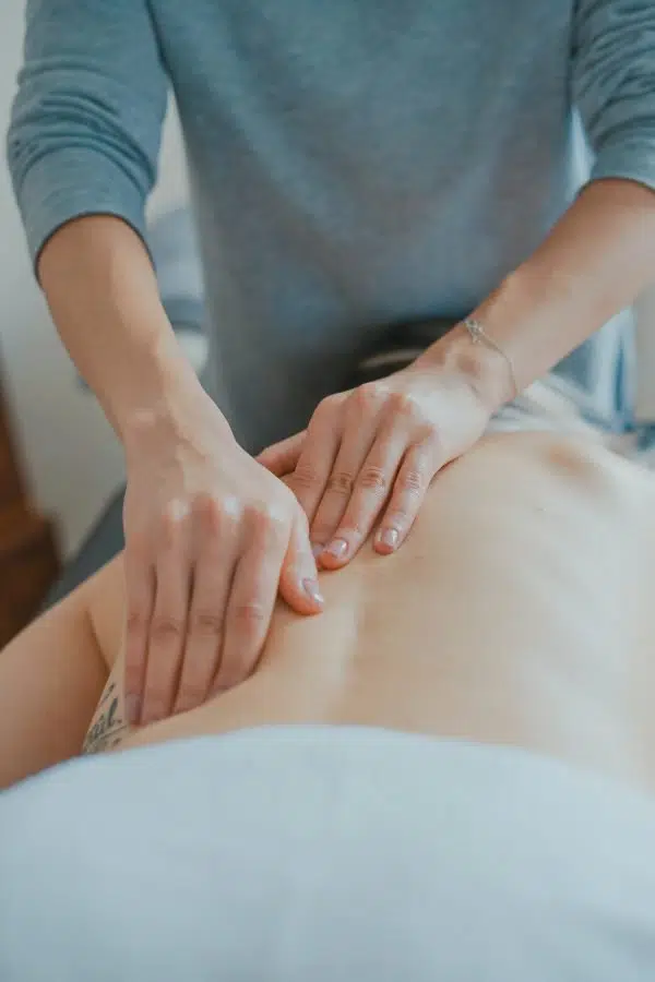 hands massaging back.