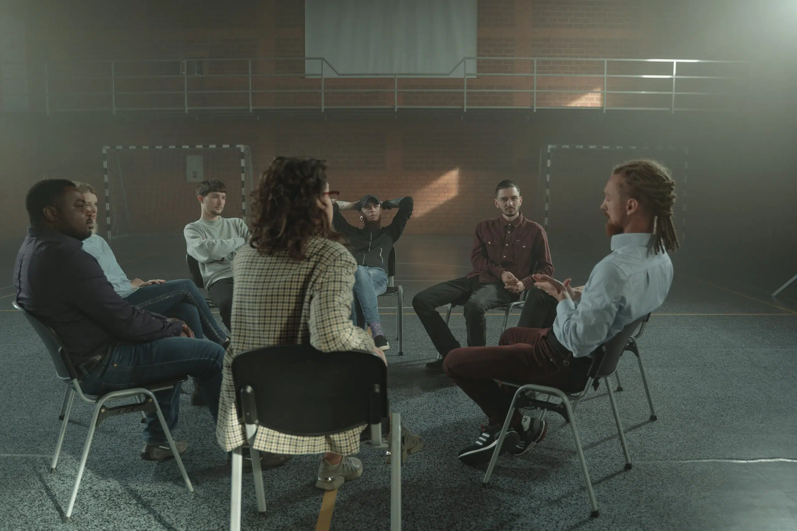 people sitting in chairs during support group.