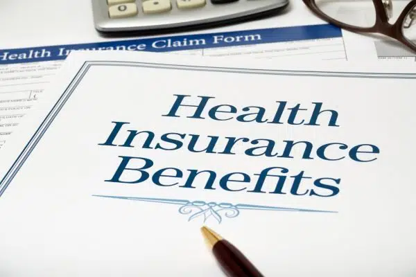 piece of paper that reads Health Insurance Benefits.