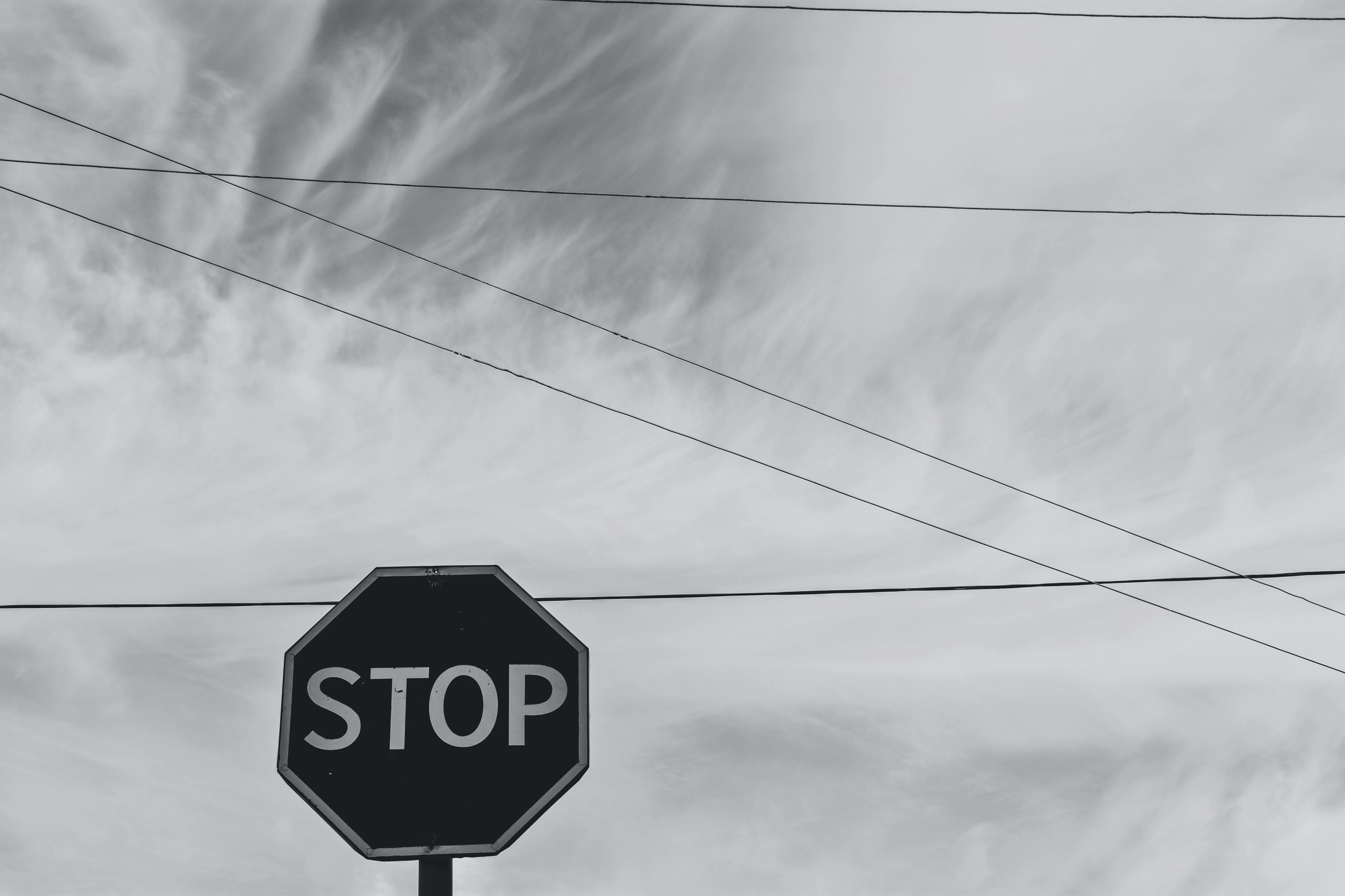 black and white photo of a stop sign.